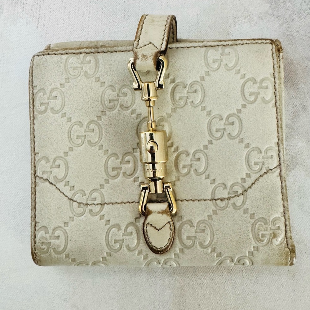 Gucci Guccissima Ivory Leather GG Logo BiFold Wallet, Gold Piston Closure
